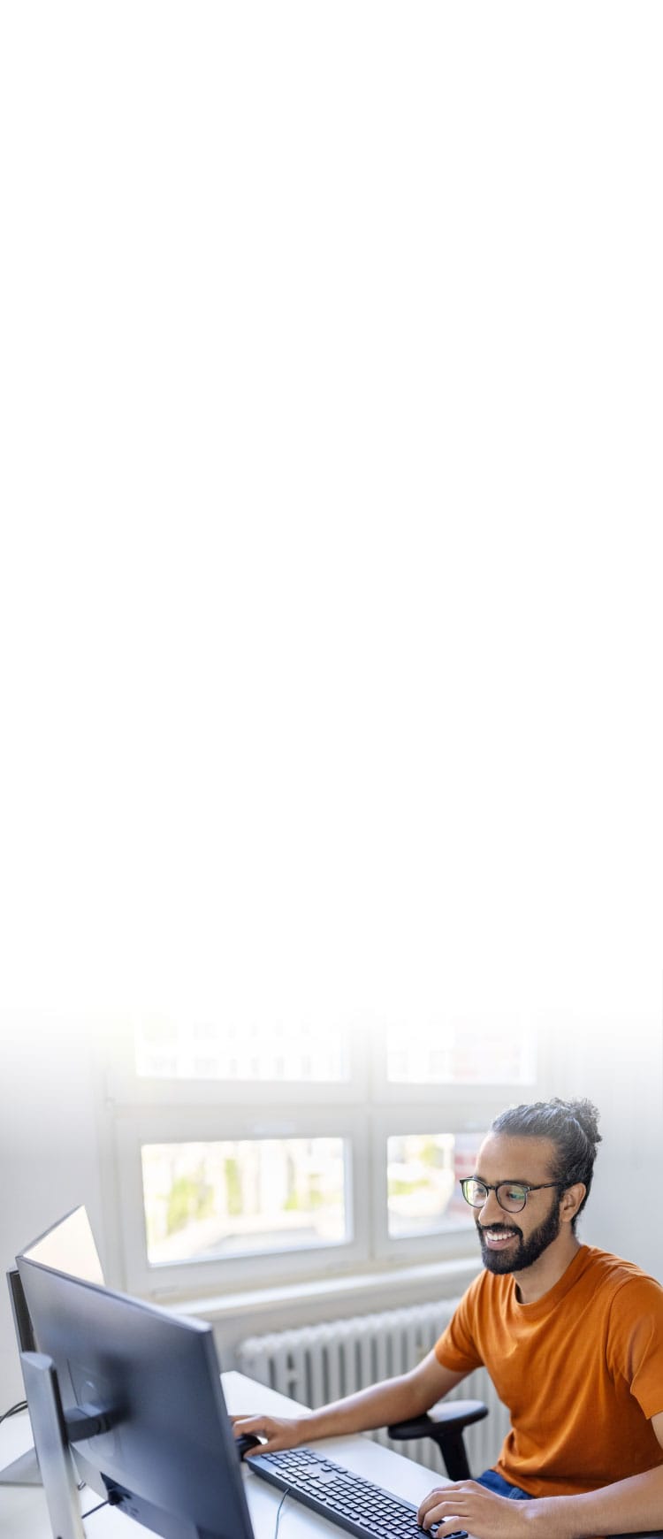 A man using Norton Utilities Ultimate to clean his PC.