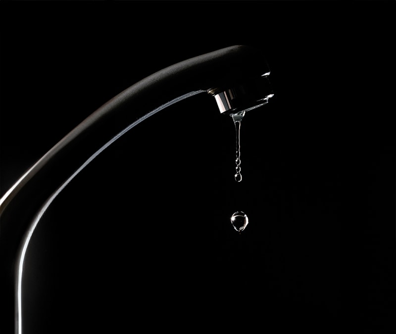 A dripping faucet symbolizing a data leak.