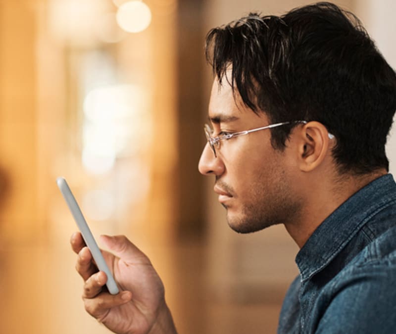 A person holding a mobile phone.