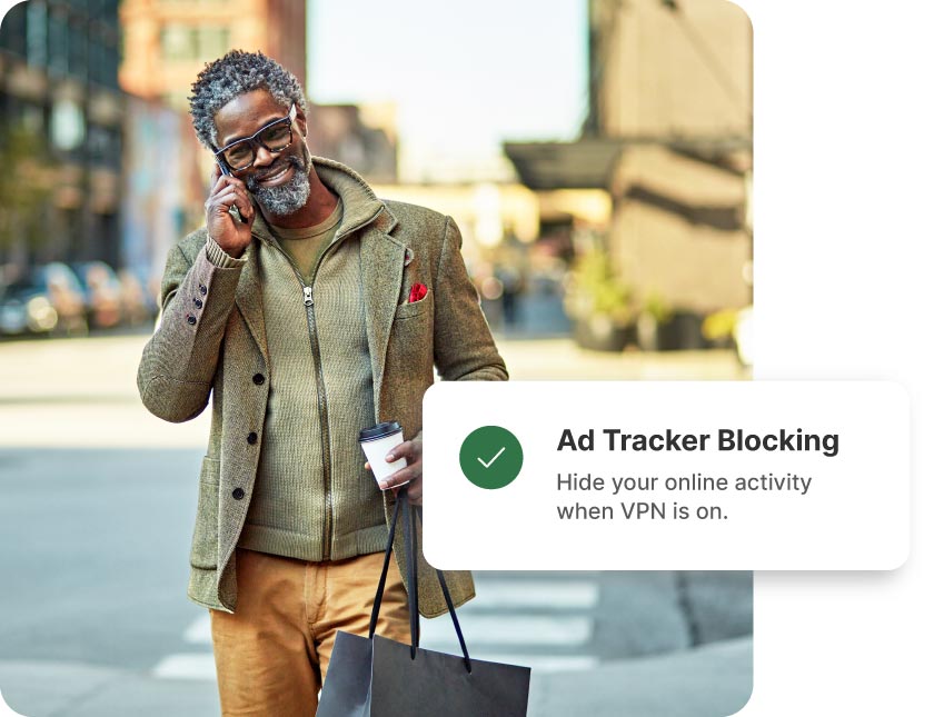 A man with a green sweater and coat uses Norton’s Double VPN because it also comes with ad-blocking technology.