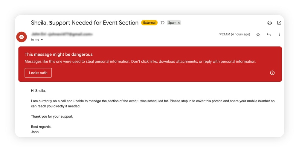A phishing email impersonating a boss, flagged with a warning that the message might be dangerous.