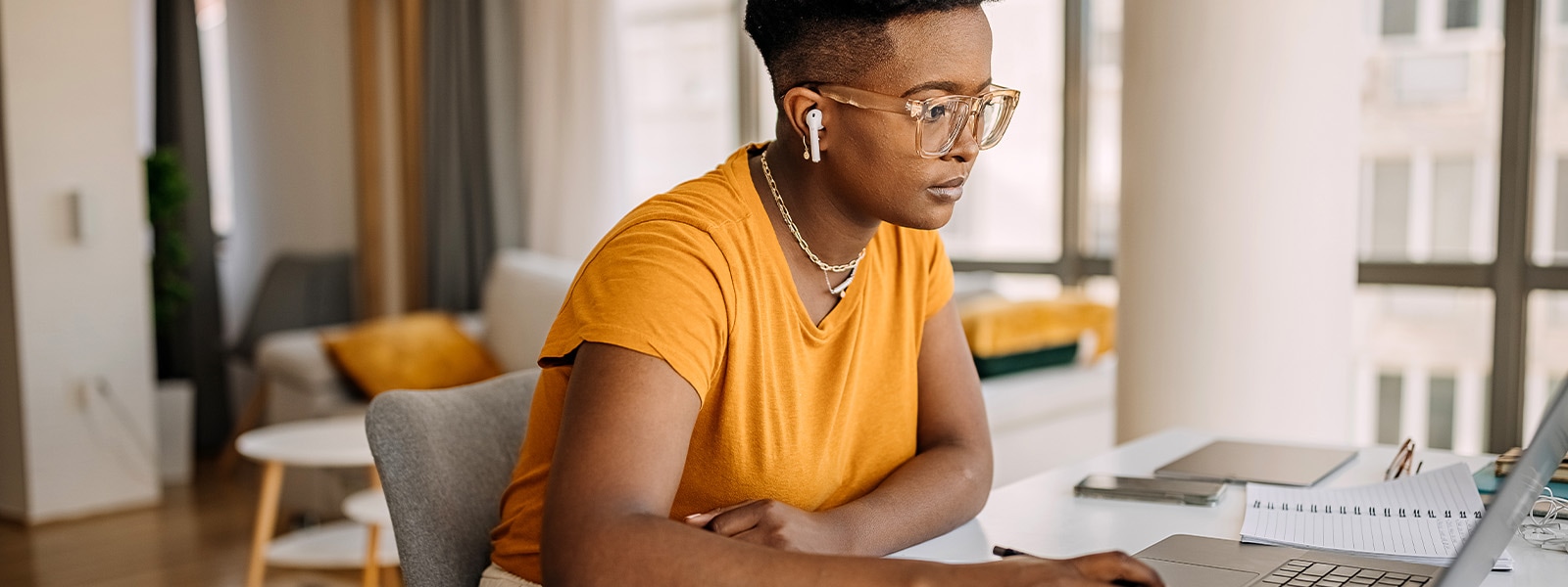 A woman learns how to install a VPN on a router after reading a how-to guide.