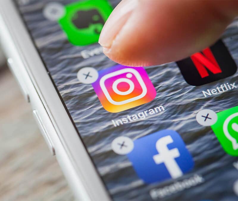 An image of someone deleting Instagram from their phone.
