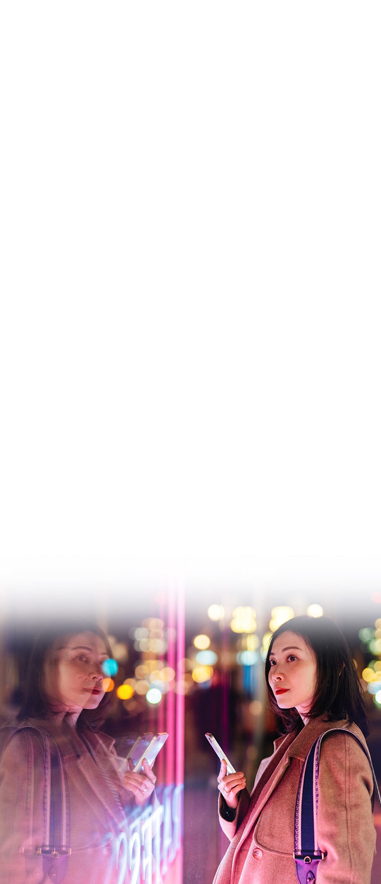 A woman checks an identity theft alert in the LifeLock app. 