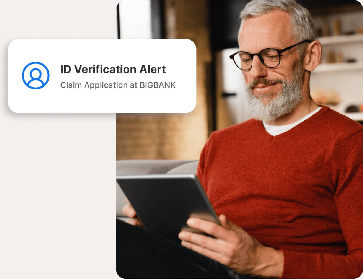 A man receives a credit inquiry alert when someone tries to open a new loan in her name. 