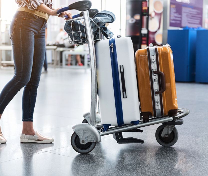 A woman walking through airport wondering how to prevent malware