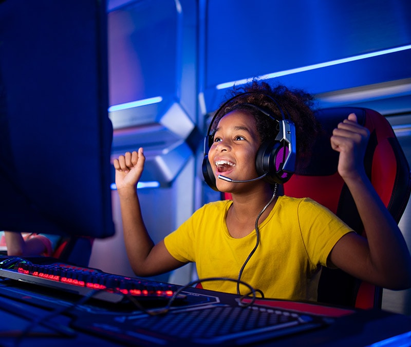 A child plays Fortnite on their computer.