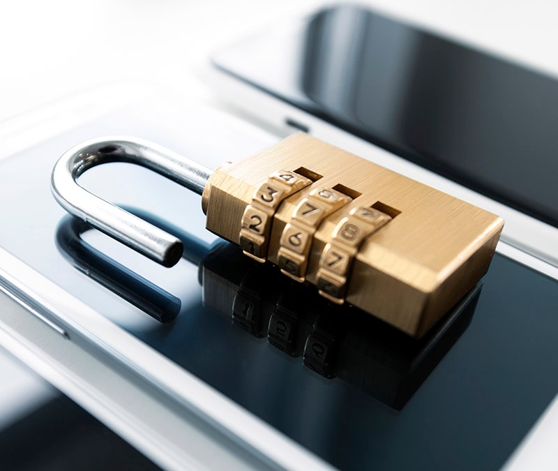 Smartphone with a padlock placed on top, symbolizing mobile security.