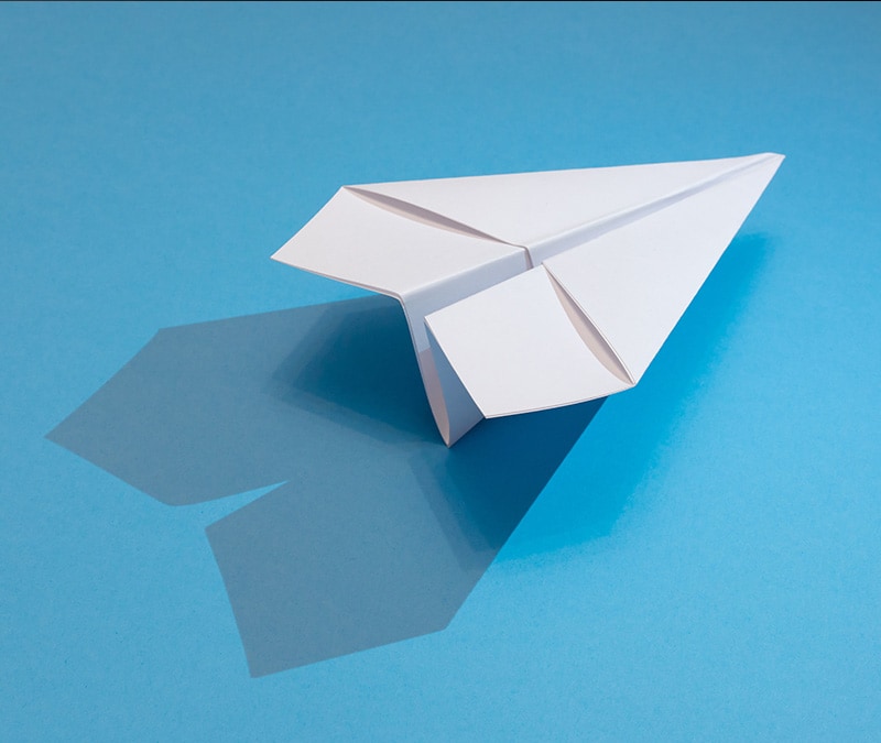 An image of a paper airplane, which looks similar to the Telegram logo.