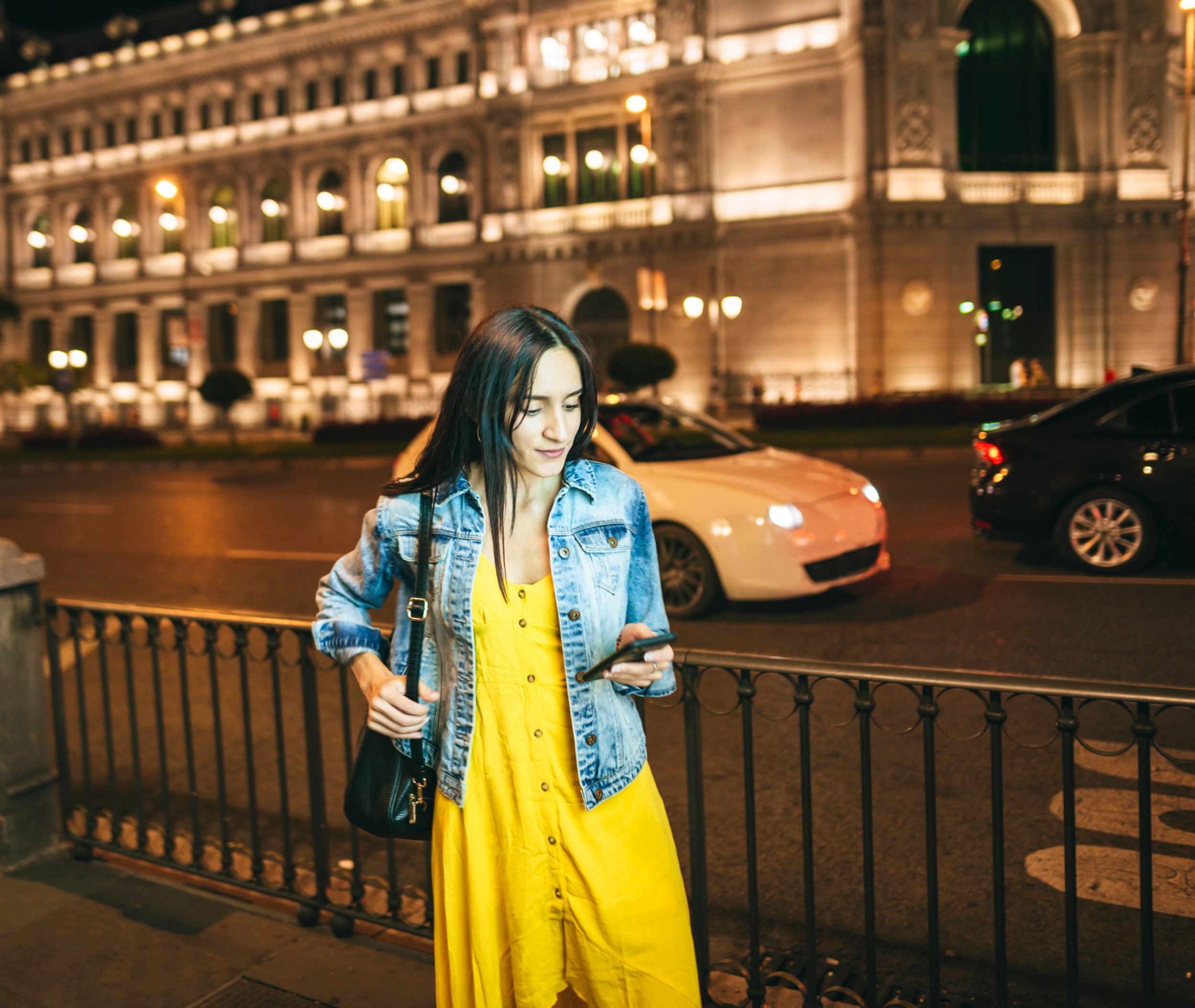 Image of a woman on her phone outside