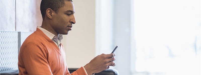 A man protecting his cellphone number from phone account takeover fraud.