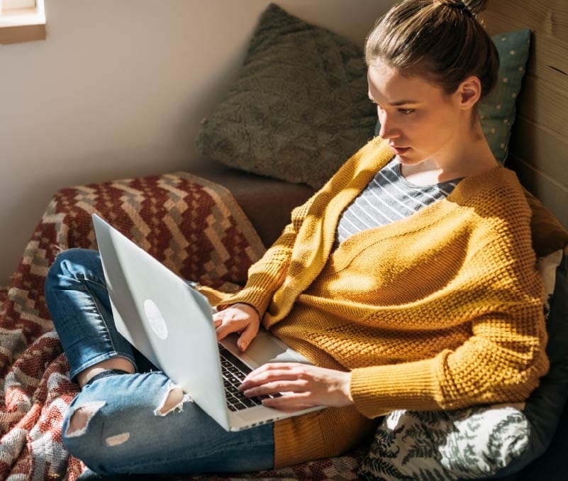 A woman reads about scareware on her laptop