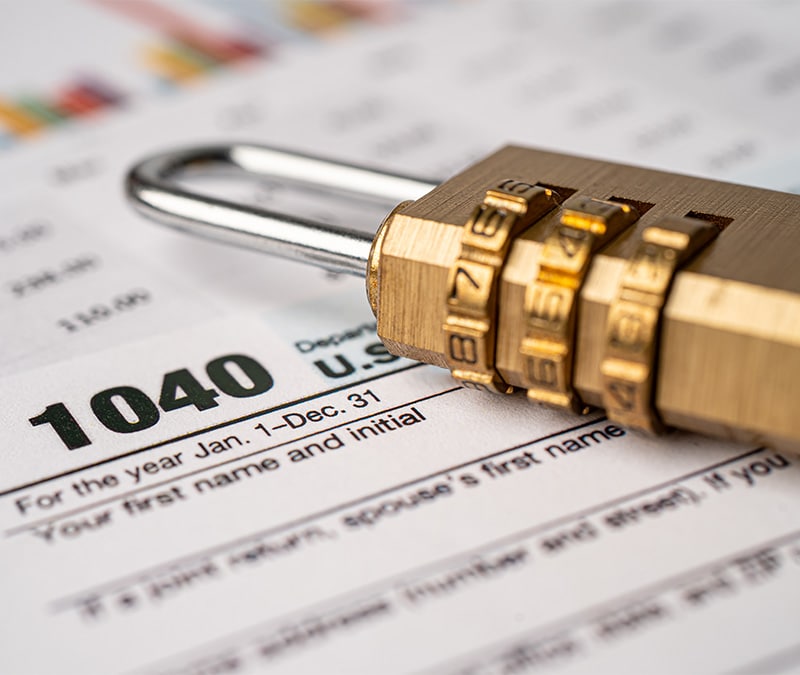 Lock lying on top of a tax document.