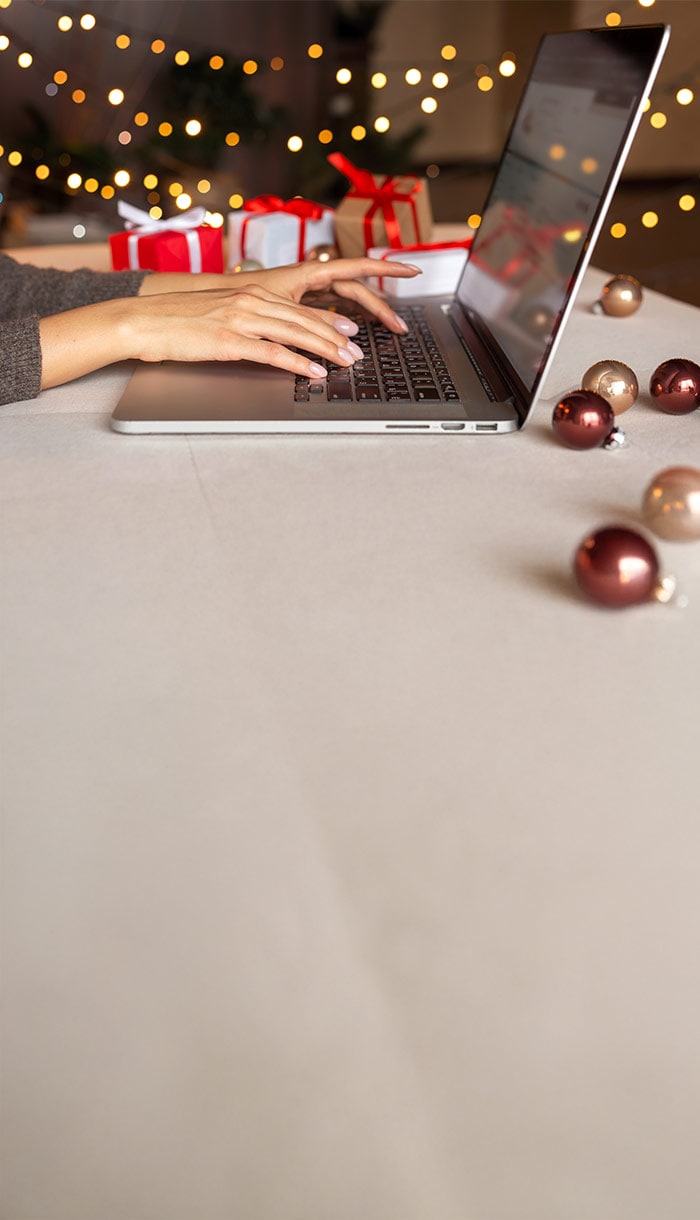 A woman happily riding in a shopping cart, symbolizing online shopping scam safety.