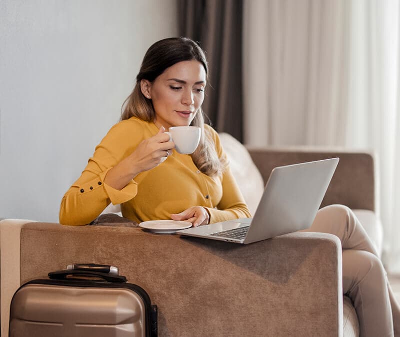 A woman in a yellow vest neglects to use a VPN while connected to hotel Wi-Fi.