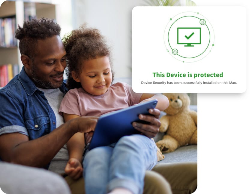 A father and daughter look at a tablet together, smiling because their device is protected.