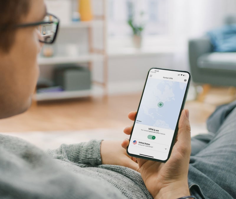 A man checks the Norton VPN app to make sure his device is still protected.
