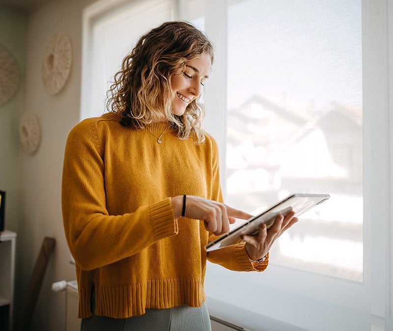 A woman uses a VPN to hide her IP address while using the internet.