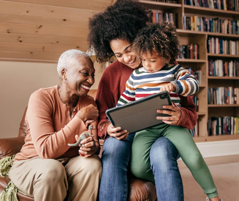 An image of a family learning what a firewall is and how it can help stop cyberattacks.