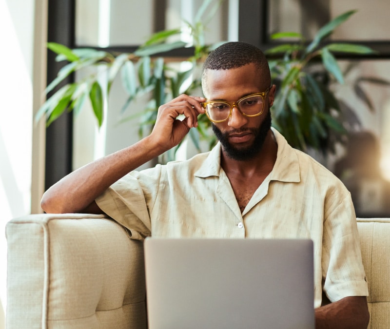 An image of a person looking at a computer, learning about spoofing.