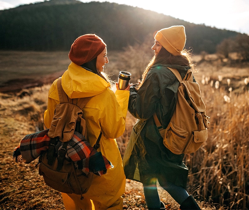 A couple goes hiking using a GPS tracker.