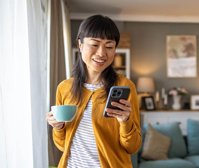 Image of a woman hiding apps on her iPhone.