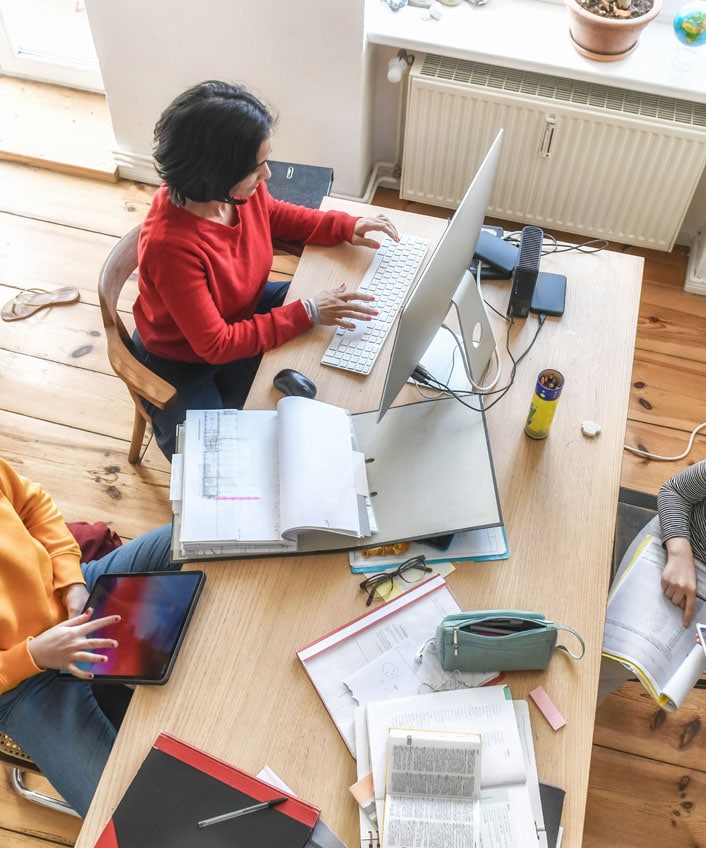 Mother researching bluetooth security next to her daughter.