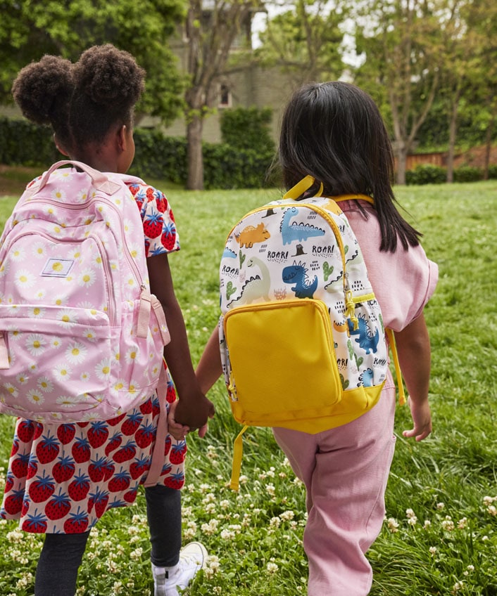 Two children walking to school to learn about data backups.