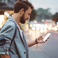 A person about to download a software update for their mobile device.