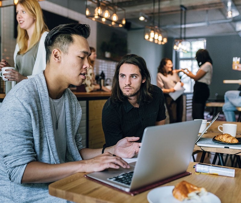 An image of someone accessing public Wi-Fi safely using a VPN.