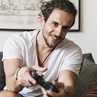 A gamer playing a relaxing video game.
