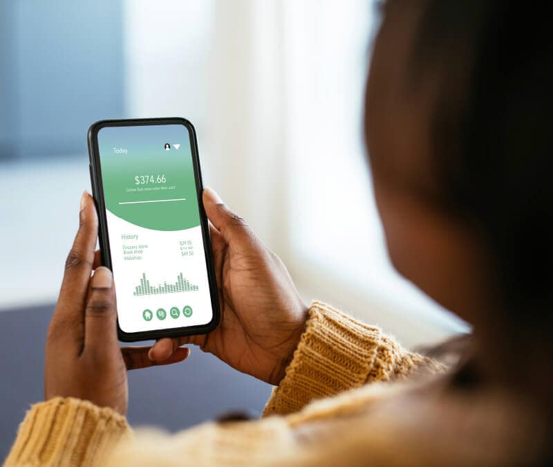 Woman tracking her expenses using a budgeting app.