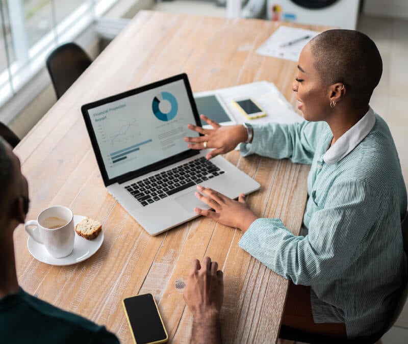 A person sitting in front of a computer checking their credit score.