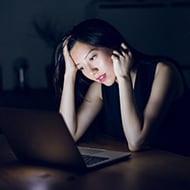A person researching "what is a computer virus."
