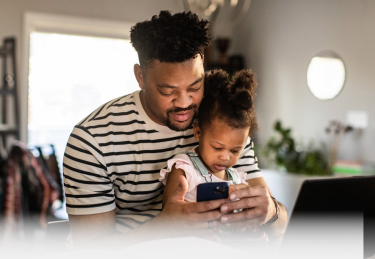 https://us.norton.com/content/dam/norton/backgrounds/father-working-from-home-with-toddler-mobile.jpg