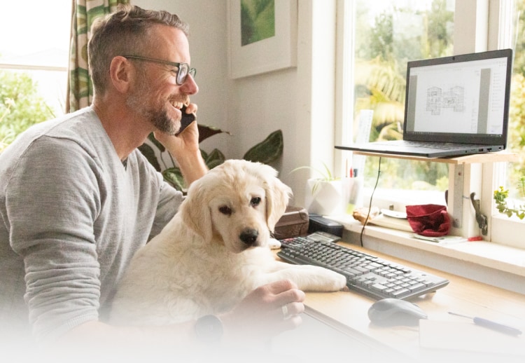 Man working from home with puppy
