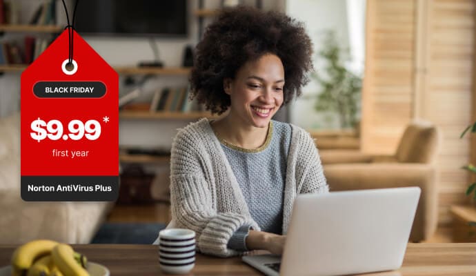Woman on computer launching Norton 360 with AntiVirus Plus.